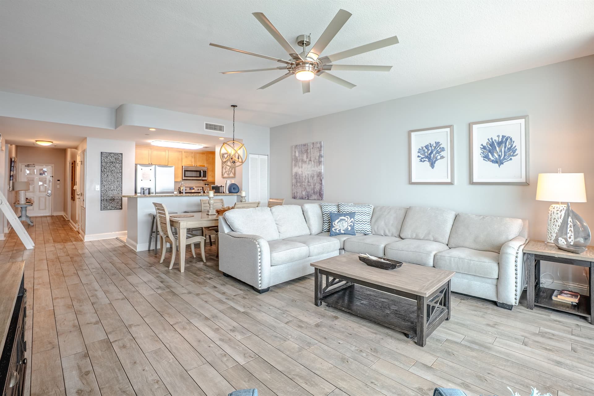 Spacious living room with large sectional sofa and coastal decor