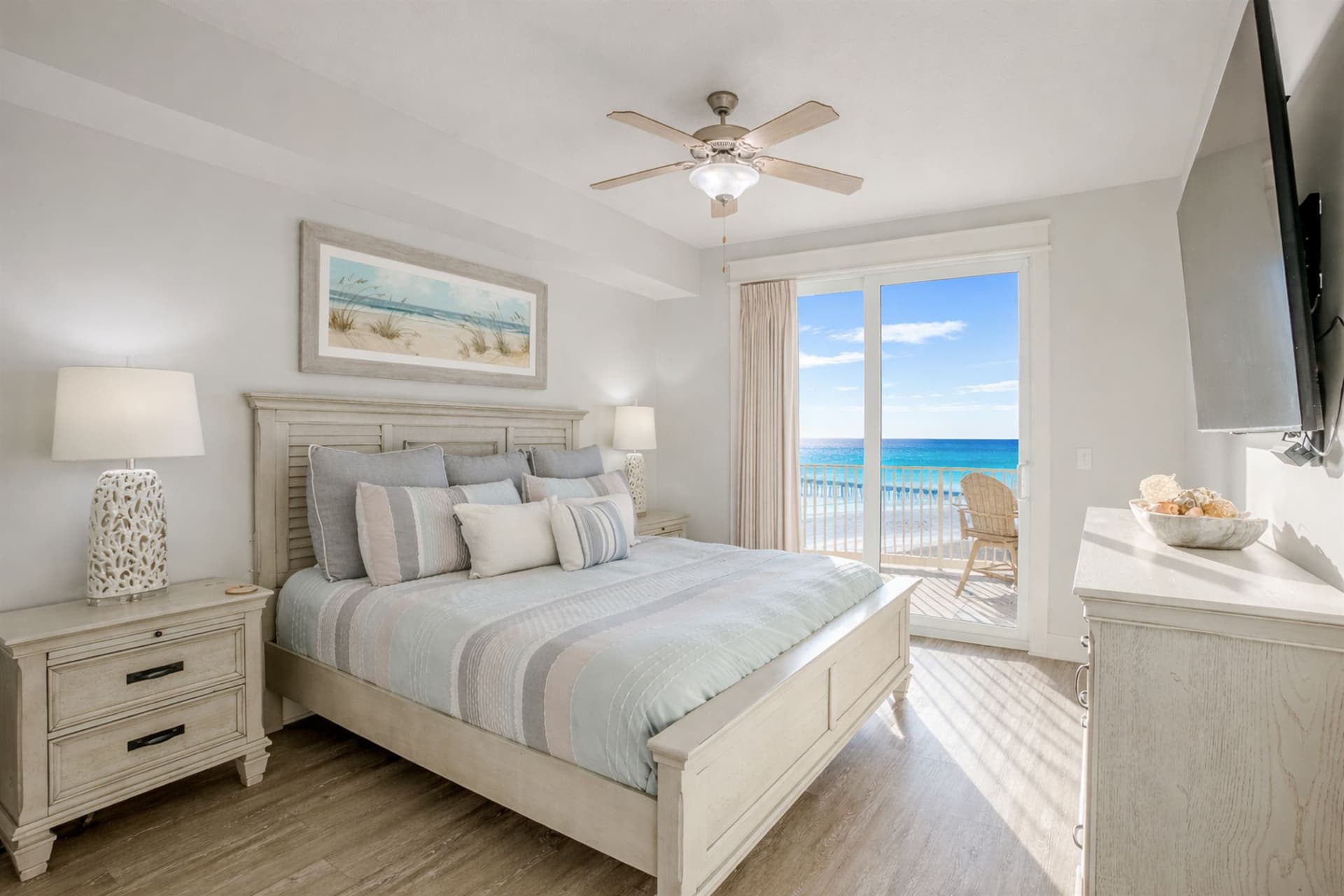 Primary bedroom with king bed and natural light